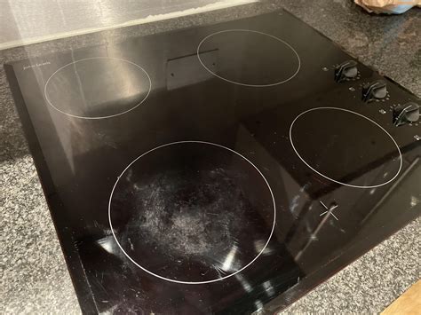 Once the allotted time has passed, simply remove the rags from the <b>stove top</b> and wipe away the particles and baking soda. . Black glass stove top scratch repair